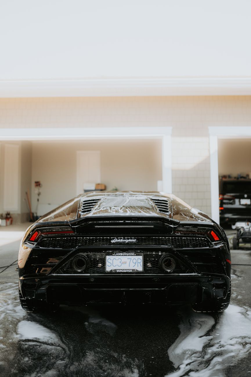 Sports car covered in wash foam