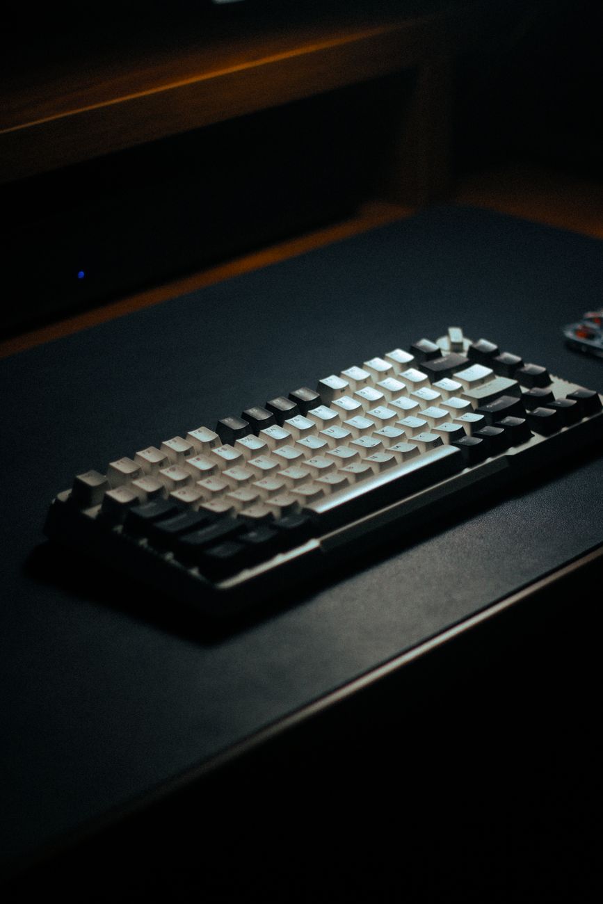 Mechanical keyboard on a dark desk