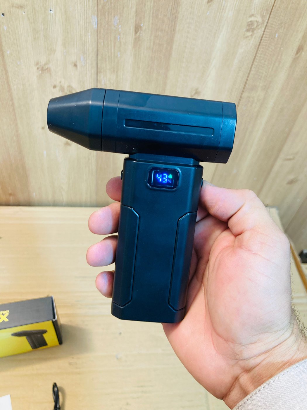 X8 Violent Fan in one hand showing power display